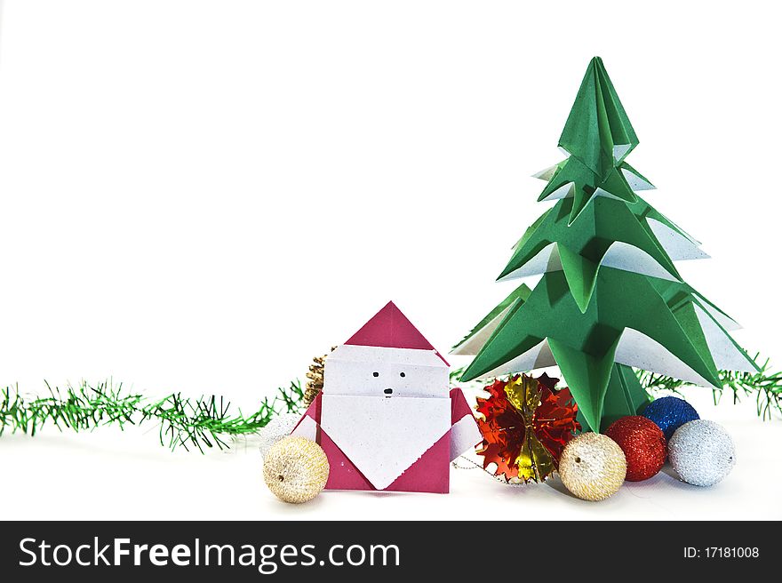 Traditional Japanese origami Christmas tree with Santa isolated on white