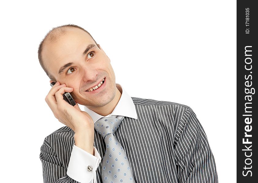 Handsome young guy using a mobile phone. Isolated on white