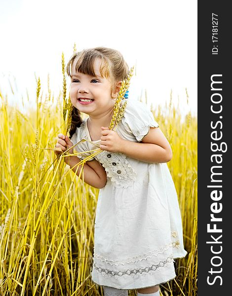 Cute happy little girl in the wheat field. Cute happy little girl in the wheat field