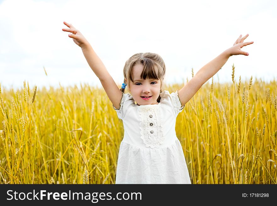 Cute happy little girl in the wheat field. Cute happy little girl in the wheat field