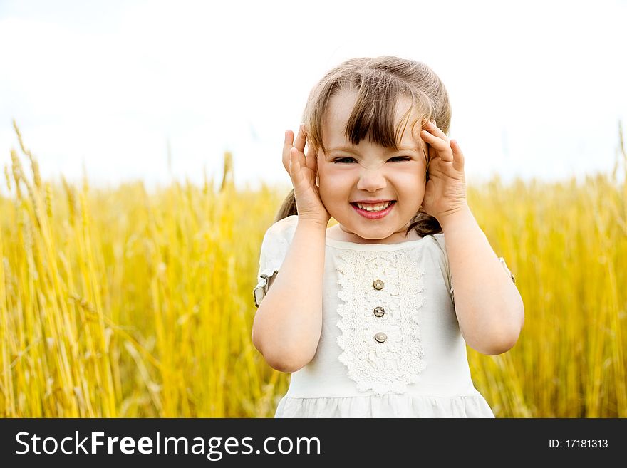 Cute happy little girl in the wheat field. Cute happy little girl in the wheat field