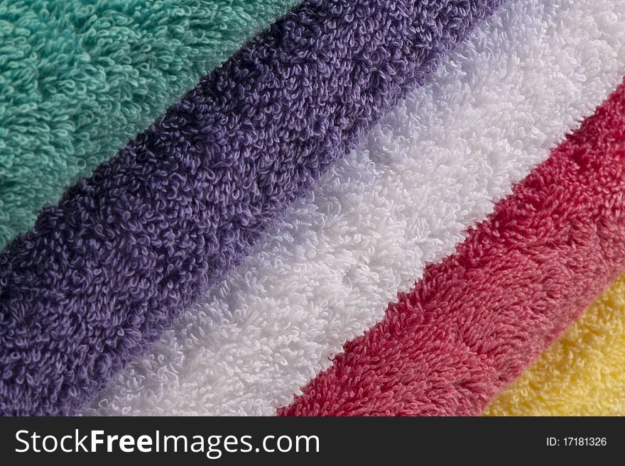 Bath towels against a white background in a studio environment