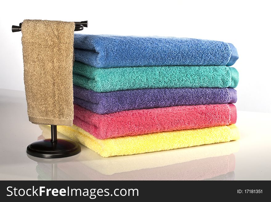 Bath towels against a white background in a studio environment. Bath towels against a white background in a studio environment