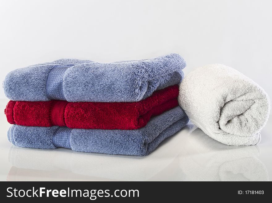 Bath towels against a white background in a studio environment. Bath towels against a white background in a studio environment