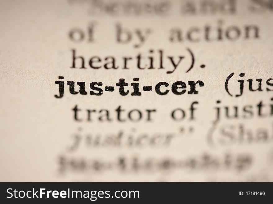 Word justicer from the old dictionary, a close up.
