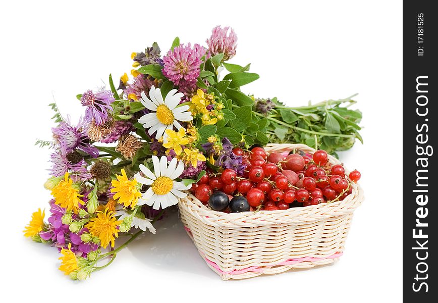 Ripe Berries In A Basket And Flowers