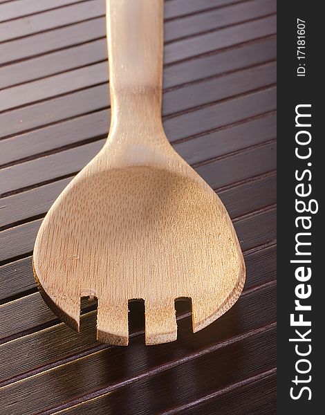 Wooden spoon - used as a tool for cooking.