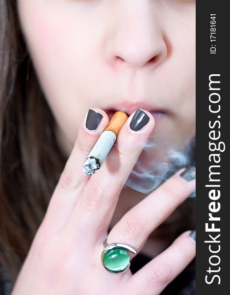 Close-up Of A Girl Holding Cigarett