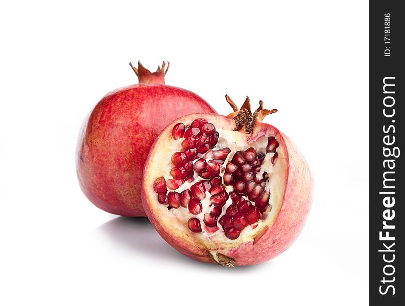 Juicy opened pomegranate on white backgrounds