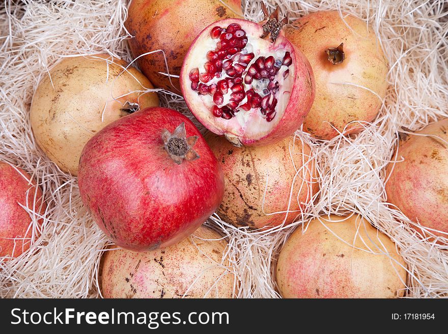 Red pomegranates in a box