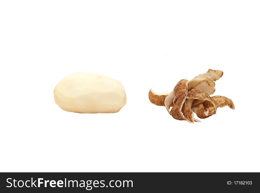 One cleared potato with clearings on the white. One cleared potato with clearings on the white