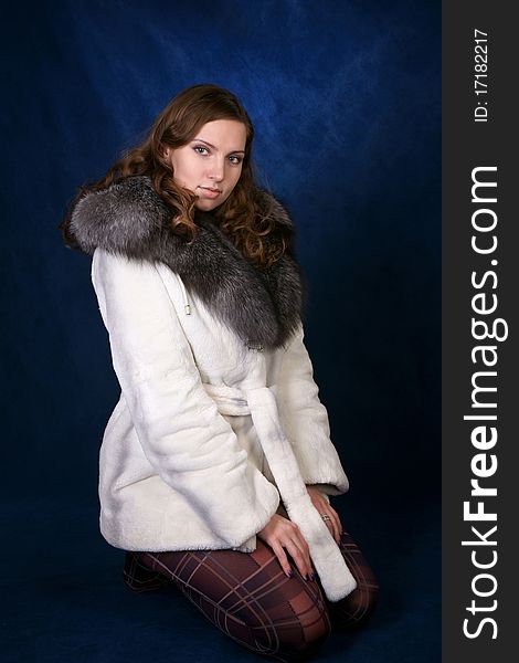 The beautiful girl in a fur fur coat