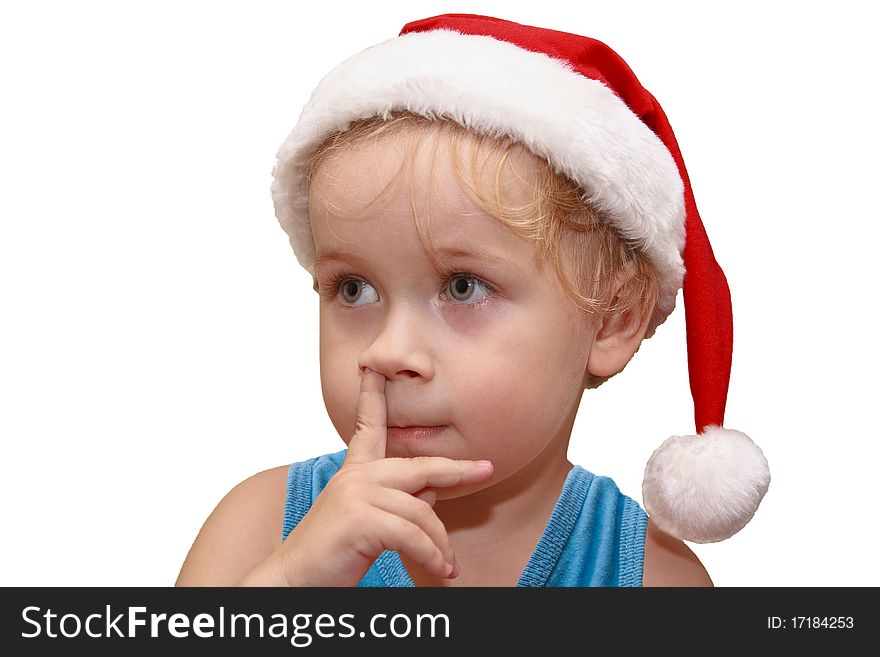 Little Santa Claus in red hat standing with a finger in his nose, isolated on white. Little Santa Claus in red hat standing with a finger in his nose, isolated on white