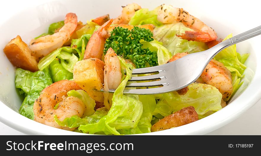 Prawn salad, with mixed greens, bread crumbs and oregano, and king-size shrimp.