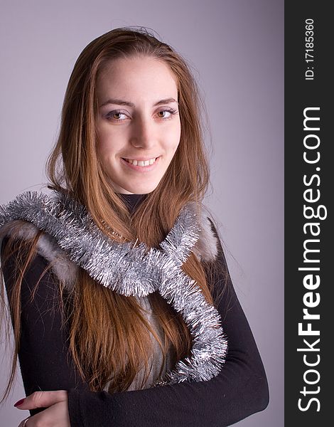 Beautiful girl with a garland smiling