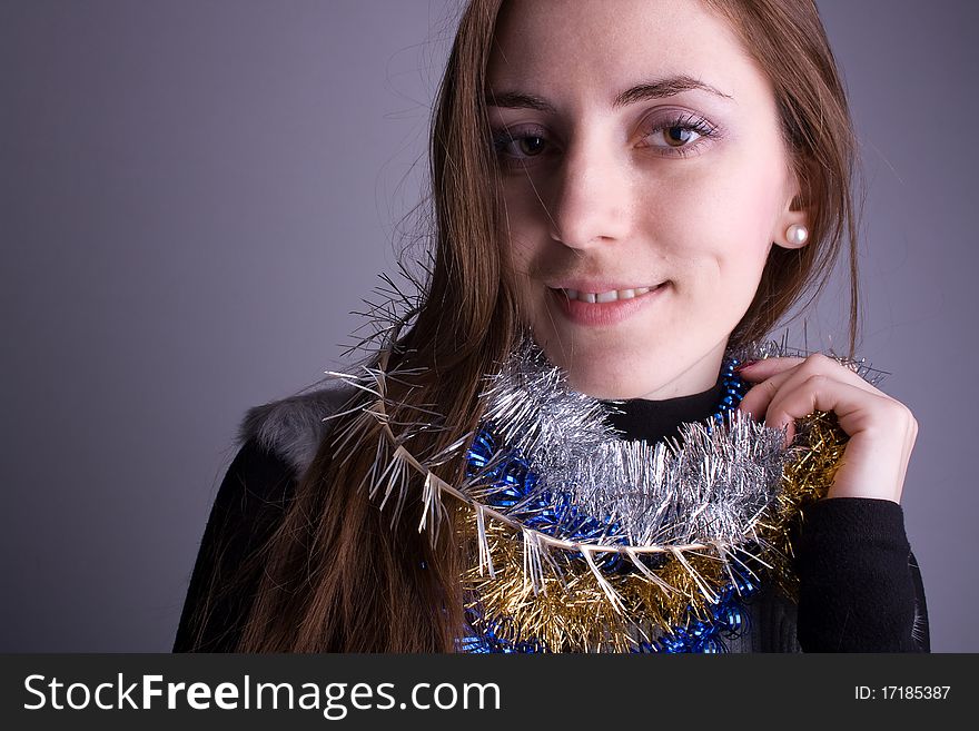 Beautiful girl with a garland smiling, portrait