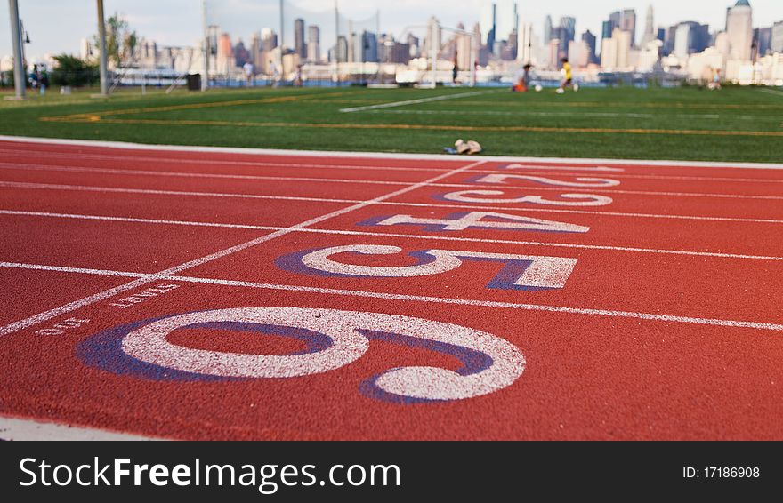 Shot of a running track and New York City skyline in the background. Shot of a running track and New York City skyline in the background