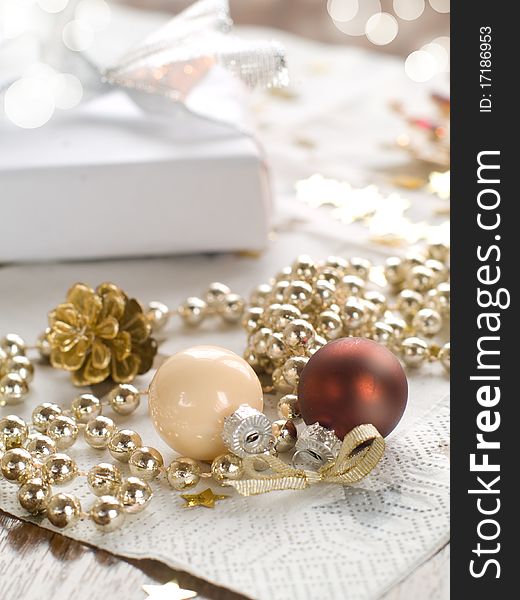 Christmas gift and baubles on light background. Christmas gift and baubles on light background