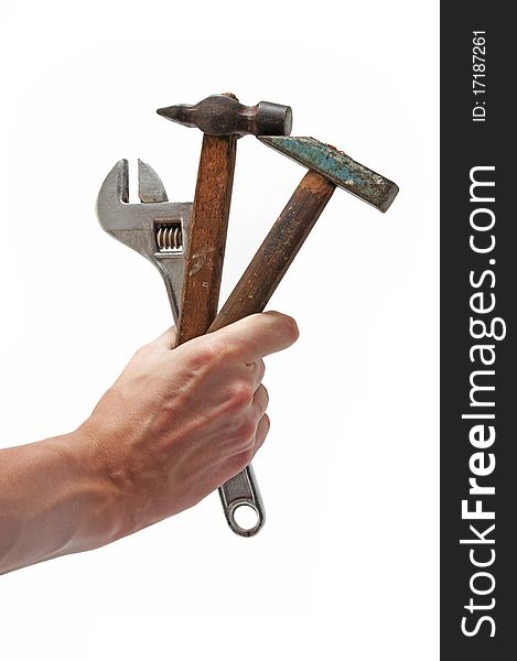 Wrench and 2 hammers in hand as gift or flowers for you isolated white