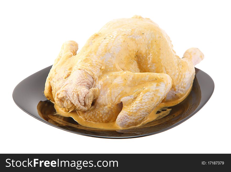 Chicken curry with the black plate on a white background