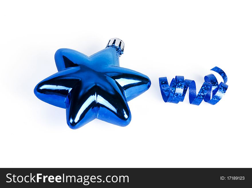 Shiny blue star-shaped christmas ornament and blue ribbon on white background. Shiny blue star-shaped christmas ornament and blue ribbon on white background