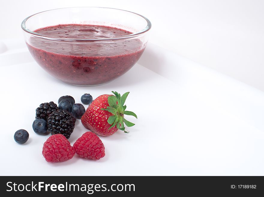 Mixed berries and smoothie in the bowl. Mixed berries and smoothie in the bowl