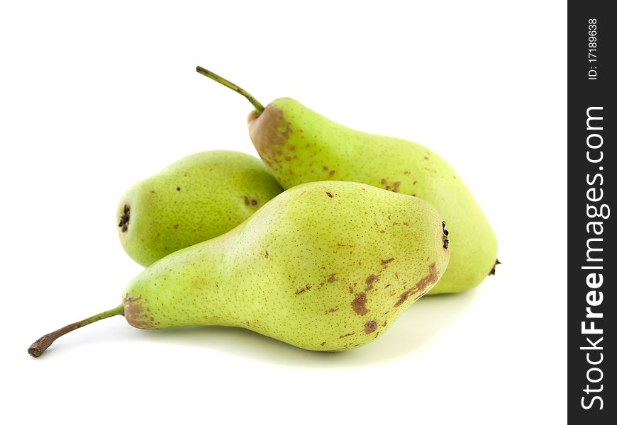 Yellow, ripe pears, white background