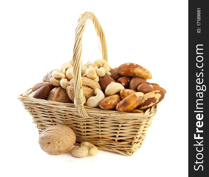 Nuts in a basket, assorted/Isolated on white background