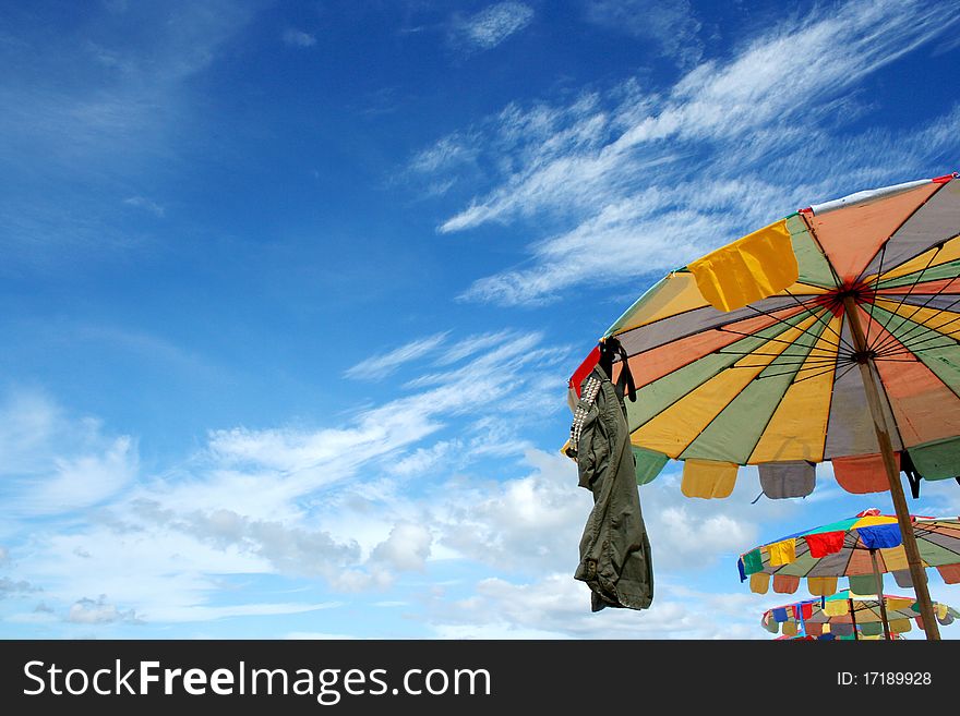 Colorful Beach Umbrella Against The Sun Light at Andaman Sea