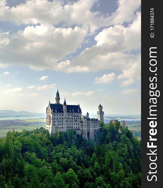 Fussen, Germany - June 27, 2019: Famous Neuschwanstein Castle in the Bavarian Alps. Romanesque Revival palace in Germany. Fussen, Germany - June 27, 2019: Famous Neuschwanstein Castle in the Bavarian Alps. Romanesque Revival palace in Germany