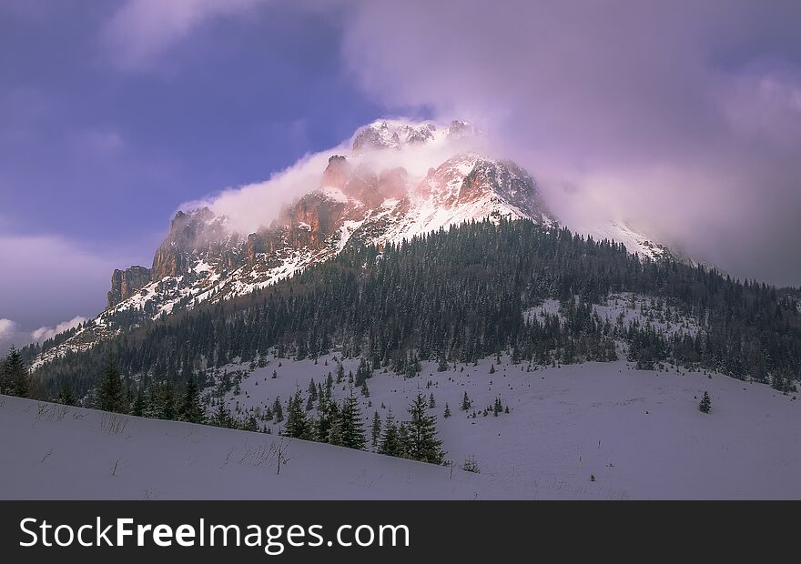 Mountain covered in clouds of cold weather wind blow upon. Mountain covered in clouds of cold weather wind blow upon