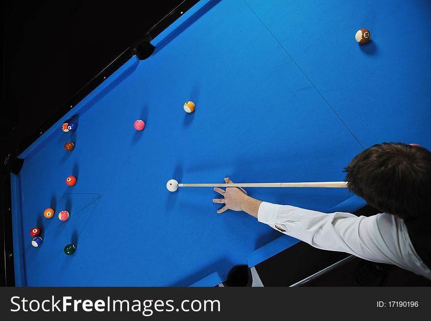 Young pro billiard player finding best solution and right angle at billard or snooker pool sport game. Young pro billiard player finding best solution and right angle at billard or snooker pool sport game