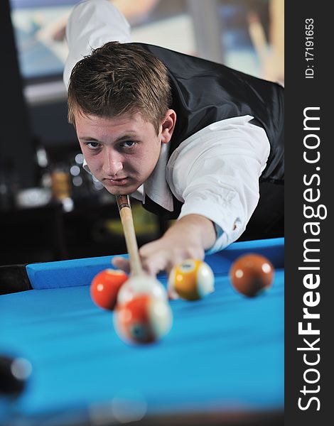 Young pro billiard player finding best solution and right angle at billard or snooker pool sport game. Young pro billiard player finding best solution and right angle at billard or snooker pool sport game