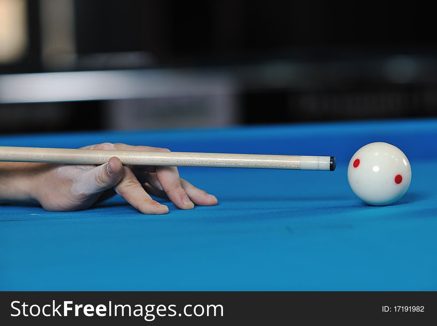 Young pro billiard player finding best solution and right angle at billard or snooker pool sport game. Young pro billiard player finding best solution and right angle at billard or snooker pool sport game