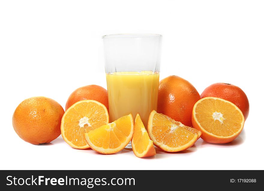 Studio photo of Oranges and glass of juice on white background. Studio photo of Oranges and glass of juice on white background