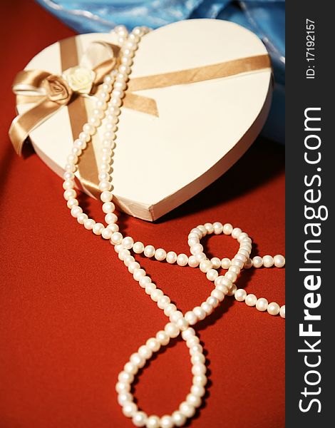 White pearls on satin.Gift box. White pearls on satin.Gift box