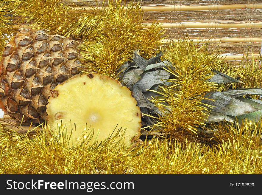 Pineapple with christmas golden decoration. Pineapple with christmas golden decoration