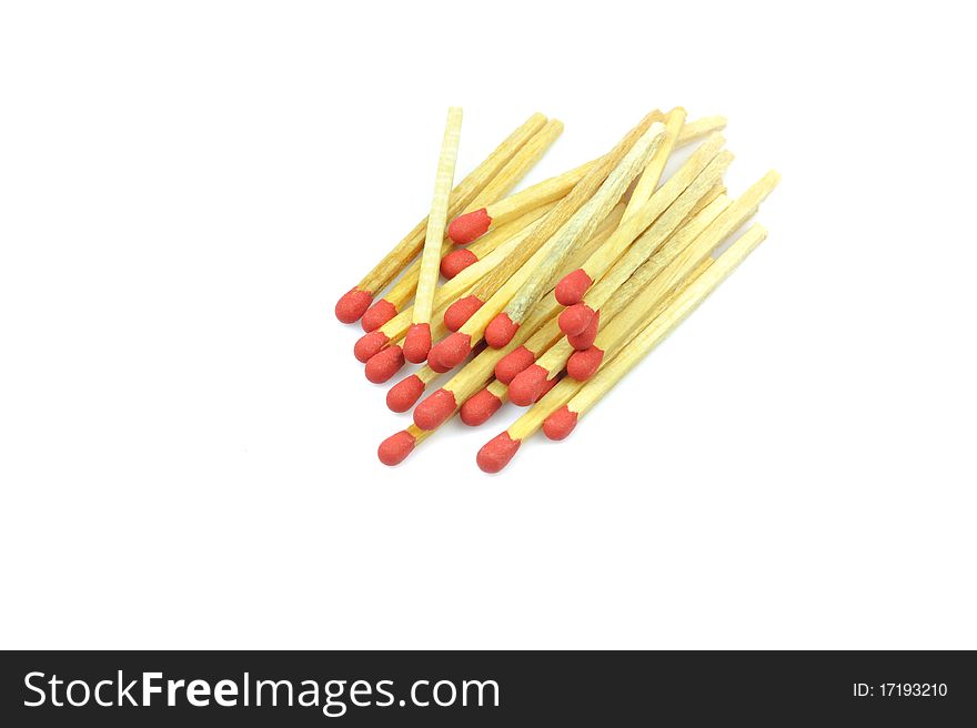 Bunch red matches close up on white background.