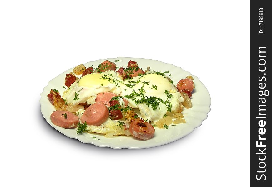 Fried eggs with sausages and bacon is shown in the picture. Fried eggs with sausages and bacon is shown in the picture.
