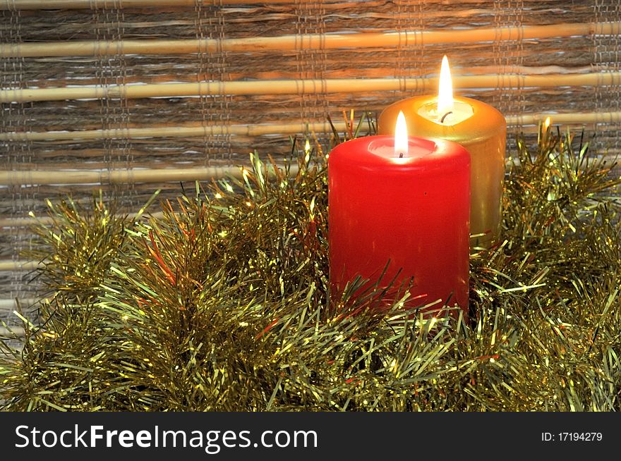 Lit candles with christmas golden decoration. Lit candles with christmas golden decoration