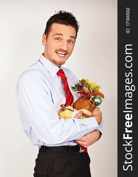 Young man in shirt and red tie hold Christmas gift and he is surprised. Young man in shirt and red tie hold Christmas gift and he is surprised