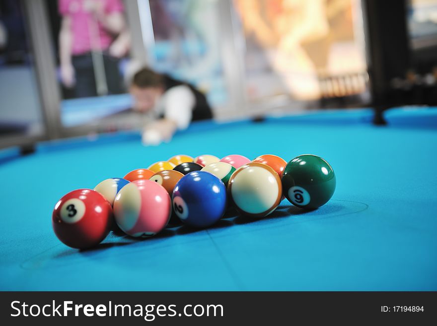 Young pro billiard player finding best solution and right angle at billard or snooker pool sport  game. Young pro billiard player finding best solution and right angle at billard or snooker pool sport  game
