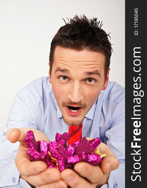 Happy young man in shirt and tie is surprised from Christmas stars. Happy young man in shirt and tie is surprised from Christmas stars.