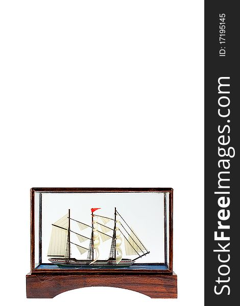 Sailing boat in glass box on white background
