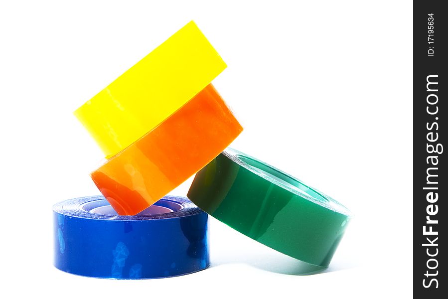Pile of colourful sellotape isolated on white background. Pile of colourful sellotape isolated on white background