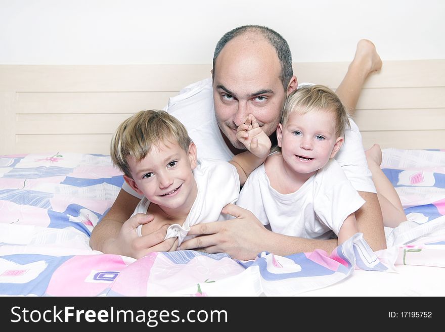 Father and two children at home