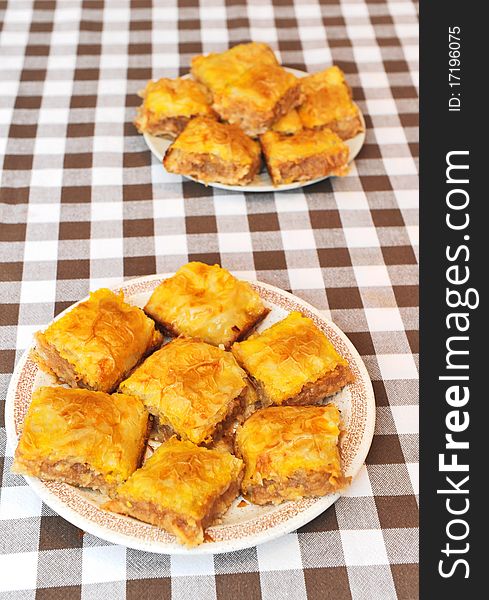 Two plates with apple pie on a table