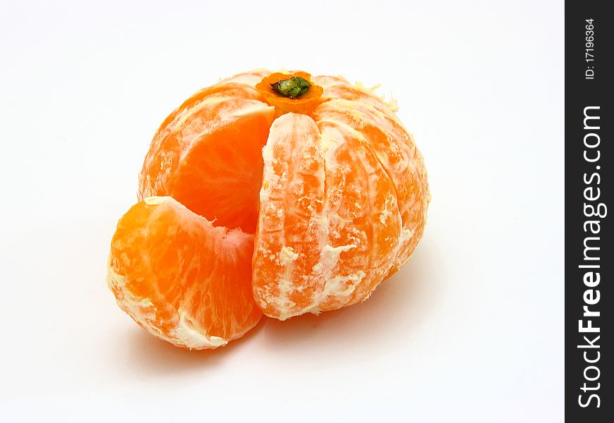 Ripe tangerines lie on a white background