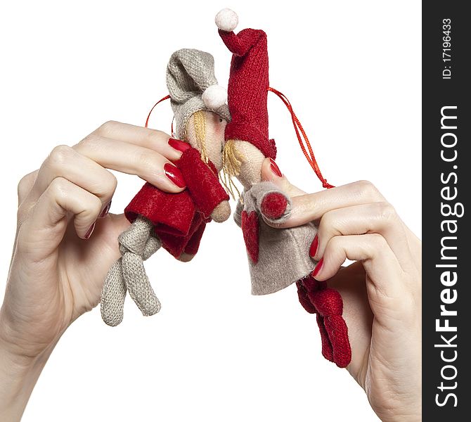 Studio photo of woman's hands playing with puppets. Pair of dwarves on the white background.