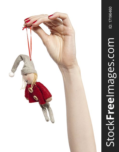 Studio photo of fwoman's hands playing with puppet. Dwarf on the white background. Studio photo of fwoman's hands playing with puppet. Dwarf on the white background.